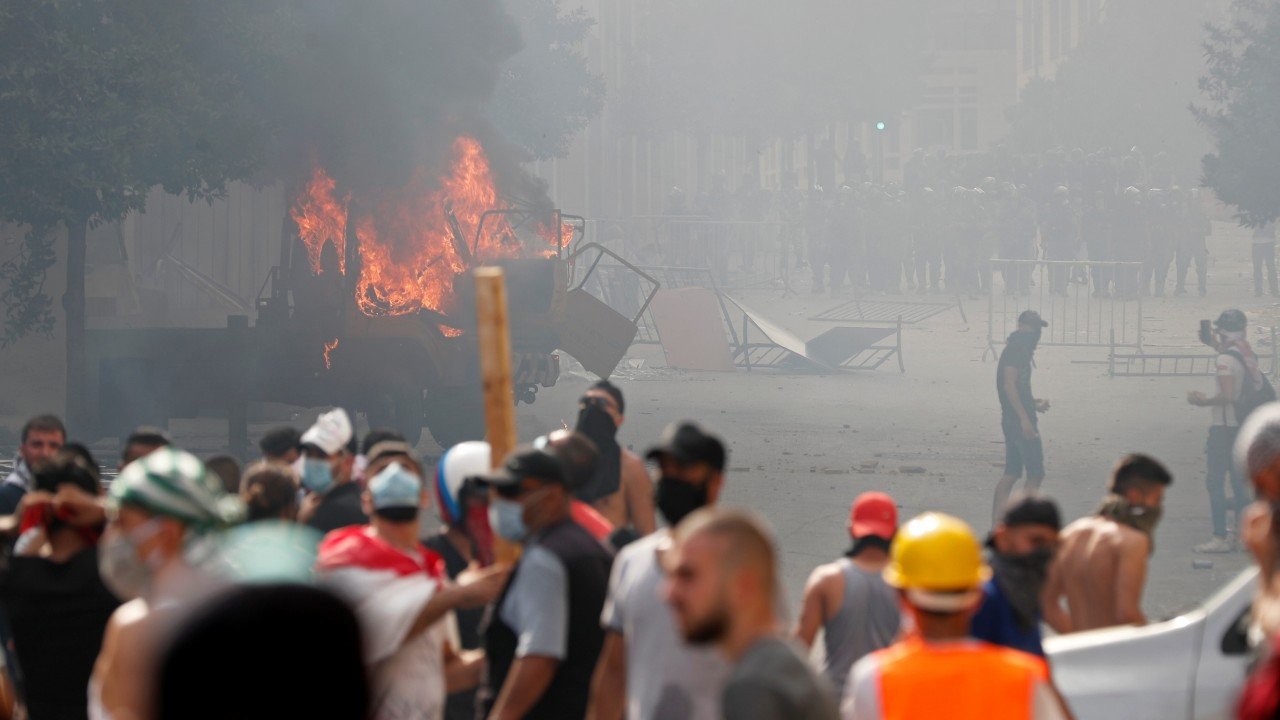 Beirut erupts in protests, police fire teargas