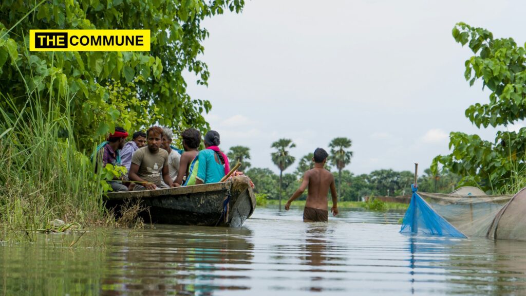 People on a boat after disaster in India